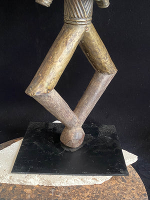 Mbulu-ngulu or funerary reliquary protective figure. Kota people, Gabon, West Africa. Mid to late 20th century. Wood with copper and brass decorative overlay. Height 54 cm, width at widest point 30 cm.