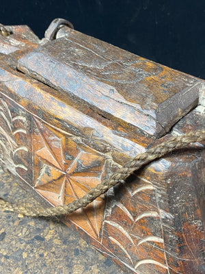 These oddly shaped pots were used to store mustard oil, ghee, yak butter and lantern oil. This very heavy example weighs 2.4 kg and is carved from solid teak. Hand beaten iron hinges. Traces of oil encrustation still inside. Age 1900-1920 or earlier. Measurements: width 29 cm, depth 12 cm, height 13.5 cm