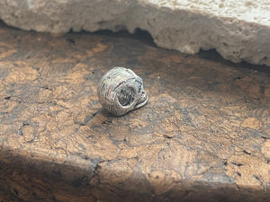 Sterling silver skull charm or pendant. Length 1 cm