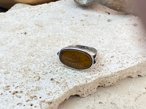 Afghani ring features an antique honey-coloured engraved carnelian prayer plaque set into a new silver band. Sits high on the finger and is a statement piece. High grade or sterling silver has been used to make the ring band. Men or women's ring. Measurements: Carnelian 2.4 x 1.4 cm, inner diameter 19.75 mm | Size 10