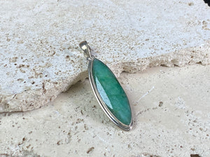 Six lush natural emerald pendants featuring large facet cut stones set in sterling silver. All are set with generous bails to fit on even the largest of chains, torcs or cords. Ranging in length from 6 cm to 2.8 cm
