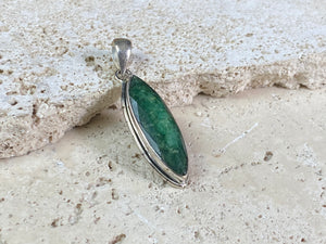 Six lush natural emerald pendants featuring large facet cut stones set in sterling silver. All are set with generous bails to fit on even the largest of chains, torcs or cords. Ranging in length from 6 cm to 2.8 cm
