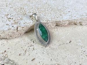Six lush natural emerald pendants featuring large facet cut stones set in sterling silver. All are set with generous bails to fit on even the largest of chains, torcs or cords. Ranging in length from 6 cm to 2.8 cm