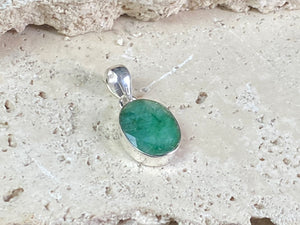 Six lush natural emerald pendants featuring large facet cut stones set in sterling silver. All are set with generous bails to fit on even the largest of chains, torcs or cords. Ranging in length from 6 cm to 2.8 cm