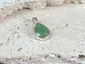 Six lush natural emerald pendants featuring large facet cut stones set in sterling silver. All are set with generous bails to fit on even the largest of chains, torcs or cords. Ranging in length from 6 cm to 2.8 cm