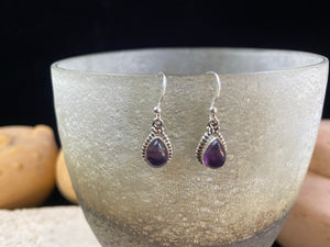 Elegant teardrop shaped earrings with a beautifully detailed bezel to show off the natural beauty of the cabochon stones. Sterling silver hooks complete the look. Our earrings are open-backed to allow natural light to show through. Length including hook 2.7 cm