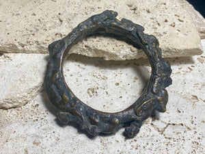 Antique Bronze Dông Son bracelet, Vietnam. Solid cast bronze bangle featuring an array of animals. Inside diameter 25 cm. Height 1.3 cm.