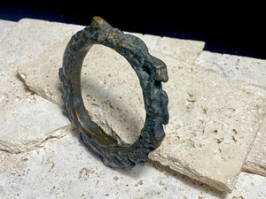 Antique Bronze Dông Son bracelet, Vietnam. Solid cast bronze bangle featuring an array of animals. Inside diameter 25 cm. Height 1.3 cm.
