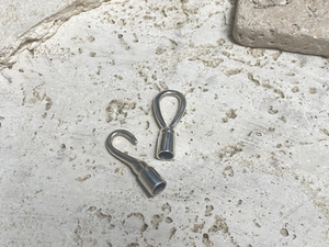 Very large hook and noose  bail clasp.
These are large and strong enough to take thick cords or chain, or can be used to finish multi strand necklaces of substance. They could also be used to finish off a bracelet design. These are perfect for one-off necklace projects when only the best will do. Length when fastened together 6 cm. Inside diameter of opening 5 mm.