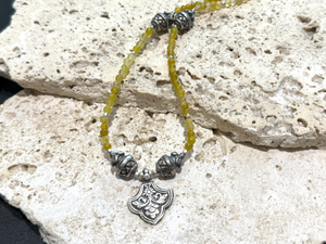 Short choker necklace of yellow jade, handmade Indian vintage silver art deco 'pineapple" beads and a centre silver pendant. 39 cm length