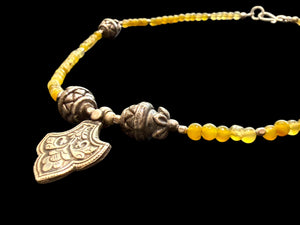 Short choker necklace of yellow jade, handmade Indian vintage silver art deco 'pineapple" beads and a centre silver pendant. 39 cm length