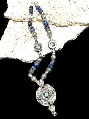 Unique statement necklace crafted from antique Afghani lapis, Indian tribal beads, old silver Uzbeki beads & an antique Tibetan centrepiece. Length 46.3 cm