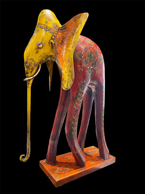 Our biggest and brightest elephant statue. Hand carved from solid hard wood with a recycled iron trunk, ears, tusks and trunk, full of gorgeous character and painted in intricate embossed detail.  Measurements: height 48.5 cm, length 32 cm, depth 12 cm