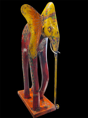 Our biggest and brightest elephant statue. Hand carved from solid hard wood with a recycled iron trunk, ears, tusks and trunk, full of gorgeous character and painted in intricate embossed detail.  Measurements: height 48.5 cm, length 32 cm, depth 12 cm
