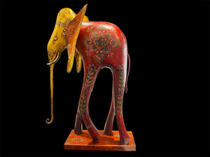 Our biggest and brightest elephant statue. Hand carved from solid hard wood with a recycled iron trunk, ears, tusks and trunk, full of gorgeous character and painted in intricate embossed detail.  Measurements: height 48.5 cm, length 32 cm, depth 12 cm