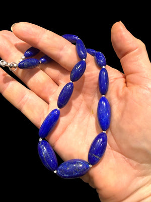 Simple and elegant, our short necklace is made from deep blue Afghan lapis lazuli and sterling silver, with a sterling silver clasp. Length 41.5 cm.