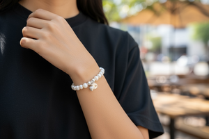 Freshwater pearl bracelet with sterling silver bead & charm detailing. Elasticised stringing for a seamless look.
Measurements: wrist circumference 16 - 17 cm.