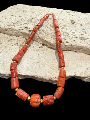 Graduated antique red coral from the Himalayas. The necklace features solid 22k gold bead highlights and a 9k gold clasp. Length 39.7 cm.