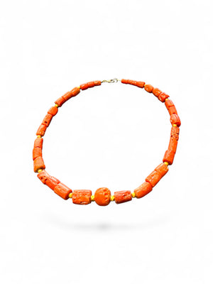 Graduated antique red coral from the Himalayas. The necklace features solid 22k gold bead highlights and a 9k gold clasp. Length 39.7 cm.