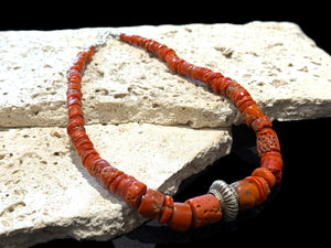 Necklace of graduated antique red coral from the Himalayas, finished with an antique silver bead and sterling silver clasp. Length 42.5 cm
