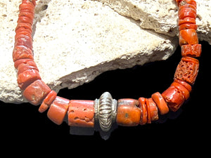 Necklace of graduated antique red coral from the Himalayas, finished with an antique silver bead and sterling silver clasp. Length 42.5 cm