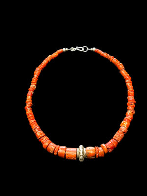 Necklace of graduated antique red coral from the Himalayas, finished with an antique silver bead and sterling silver clasp. Length 42.5 cm