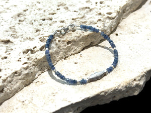 Fine beaded bracelet of facet cut sapphire, finished with a vintage sterling silver feature bead, spacer beads and clasp. Length 16.2 cm, size 14 cm.