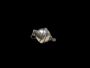 Unique tribal bead with two offset bails. Copper and silver, small glass bead set at one end. Early 20th C, northern India. Length 2.7 cm, diameter 1.7 cm.
