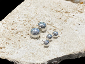 Sterling silver buttons. Large loops/bails. Sturdy construction, will not dent.  Diameter large 1.5 cm, small 0.8 cm