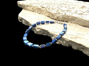 Organic look irregular square cut lapis lazuli bead and silver bracelet.