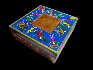 This charmingly painted box features one single, square compartment and features a lid that lifts off completely. The roominess of the box means it is perfect for holding everything from trinkets to jewellery and keys. A lovely, hand painted piece of craftsmanship from Rajasthan, India.
Every box is hand painted differently so expect variation I colour and pattern when ordering.
Measurements: width 20, depth 20 cm, height 7.5 cm