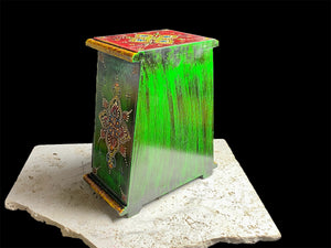 This intricately hand painted box features three drawers and small feet. Brass knobs as handles add a touch of elegance, perfect for holding everything from trinkets to jewellery. Width 21.5, depth 11.5 cm, height 24 cm