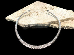 Silver hansuili torc necklace. Gujarat, early to mid 20th C. Inside width 13.8 cm, at opening 6.5 cm