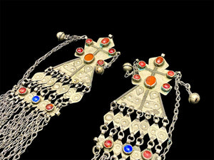 Turkoman headdress jewellery. Low grade or no silver, carnelian and glass stones, leaf and diamond shaped dangles and bells. Ersari. Mid 20th C. Length 43 cm