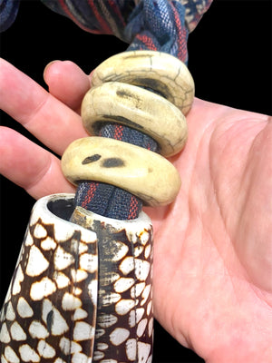 Bontoc woman’s belt (akusan). Cloth, shell, bone. Early 20th century. Bontoc people, Bontoc region, Philippines. Length 91 cm, length of longest shell 6.5 cm