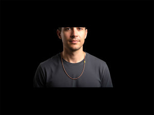 Natural serpentine bead necklace in a mat red-brown colour. Brass metal screw clasp. Measurements: 39 cm length, tube beads 2 mm diameter