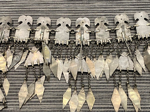 Ersari headdress consisting of a metal gaashbaagh & a high embroidered conical hat into which it attached with long spikes. The cap is quilted cotton covered in velvet and detailed silk embroidery. An heirloom piece, dating from 1870-1890. Cap height 23 cm. Tiara: width 53 cm, height of band 7 cm, side dangles 44 cm