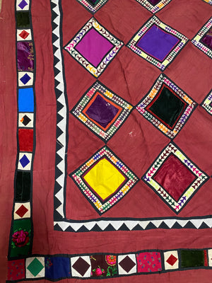 Uzbeki Afghani korak patchwork. Geometric patchwork of cotton, silk, velvet & embroidered fabric squares, framed with embroidery. Traditionally used by nomads as coverlets or wall hangings in their tents. Protects against evil eye. This is a fine example of this style of workmanship. Early 20th C: 200 x 173 cm