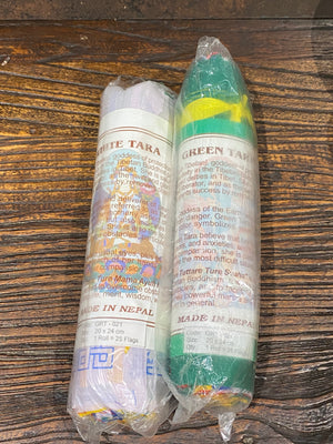 Prayer flags with the mantras to the Compassionate Buddha, Green Tara and White Tara. Every time they flutter, all prayers are offered to heaven on your behalf, promoting peace, compassion, strength & wisdom. Hand printed cotton, Nepal. Extra long strings of 6.5 metres, 25 flags, each flag 20 x 24 cm