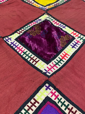 Uzbeki Afghani korak patchwork. Geometric patchwork of cotton, silk, velvet & embroidered fabric squares, framed with embroidery. Traditionally used by nomads as coverlets or wall hangings in their tents. Protects against evil eye. This is a fine example of this style of workmanship. Early 20th C: 200 x 173 cm