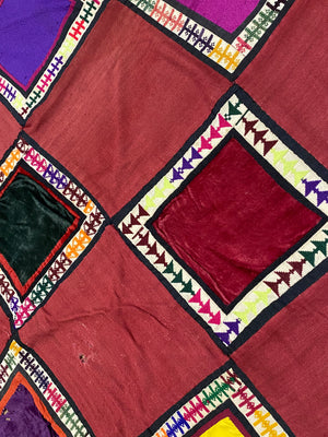 Uzbeki Afghani korak patchwork. Geometric patchwork of cotton, silk, velvet & embroidered fabric squares, framed with embroidery. Traditionally used by nomads as coverlets or wall hangings in their tents. Protects against evil eye. This is a fine example of this style of workmanship. Early 20th C: 200 x 173 cm