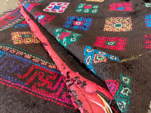 Yathra weaving, from the Chumey Valley in Bumthang, Bhutan. Hand spun and natural dyed yarn is backstrap woven into wool panels, then embroidered with wool thread. Mid 20th century. This textile is called a denkeb and was likely used as a rain cloak. Its condition is commensurate with its age. Measurements: 173 x 84 cm