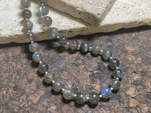 Beautiful labradorite necklace made from round labradorite beads highlighted with fine sterling silver beads designed to highlight the iridescent quality of the stone. Our necklace is strung on premium stringing material and is finished with a sterling silver hook clasp and findings. Measurements: length 43 cm (16.8")