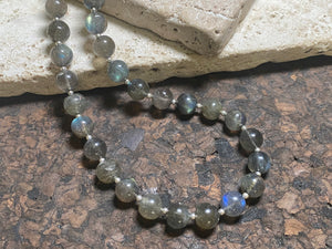 Beautiful labradorite necklace made from round labradorite beads highlighted with fine sterling silver beads designed to highlight the iridescent quality of the stone. Our necklace is strung on premium stringing material and is finished with a sterling silver hook clasp and findings. Measurements: length 43 cm (16.8")