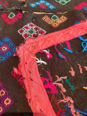 Yathra weaving, from the Chumey Valley in Bumthang, Bhutan. Hand spun and natural dyed yarn is backstrap woven into wool panels, then embroidered with wool thread. Mid 20th century. This textile is called a denkeb and was likely used as a rain cloak. Its condition is commensurate with its age. Measurements: 173 x 84 cm