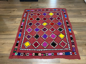 Uzbeki Afghani korak patchwork. Geometric patchwork of cotton, silk, velvet & embroidered fabric squares, framed with embroidery. Traditionally used by nomads as coverlets or wall hangings in their tents. Protects against evil eye. This is a fine example of this style of workmanship. Early 20th C: 200 x 173 cm