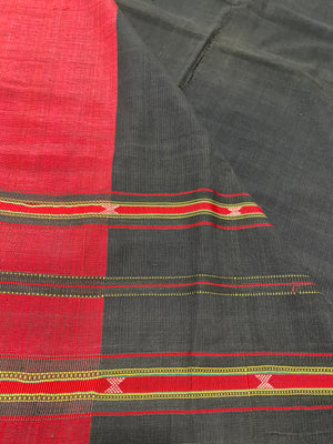 Waziri men's shawl or chador, Northwest Frontier Pakistan/Afghanistan. Hand loomed in two pieces sewn together. Dark indigo/black cotton body is woven with red silk and a stripped patterned border as contrast. Early 20th C, most likely an heirloom piece used only once. In superb condition without blemish. 231 x 134 cm