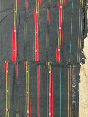 Waziri men's shawl or chador, Northwest Frontier Pakistan/Afghanistan. Hand loomed in two pieces sewn together. Dark indigo/black cotton body is woven with red silk and a stripped patterned border as contrast. Early 20th C, most likely an heirloom piece used only once. In superb condition without blemish. 231 x 134 cm