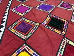 Uzbeki Afghani korak patchwork. Geometric patchwork of cotton, silk, velvet & embroidered fabric squares, framed with embroidery. Traditionally used by nomads as coverlets or wall hangings in their tents. Protects against evil eye. This is a fine example of this style of workmanship. Early 20th C: 200 x 173 cm