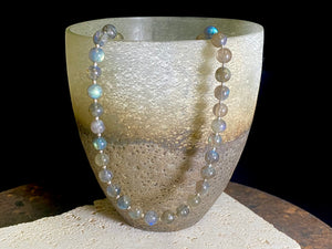 Beautiful labradorite necklace made from round labradorite beads highlighted with fine sterling silver beads designed to highlight the iridescent quality of the stone. Our necklace is strung on premium stringing material and is finished with a sterling silver hook clasp and findings. Measurements: length 43 cm (16.8")